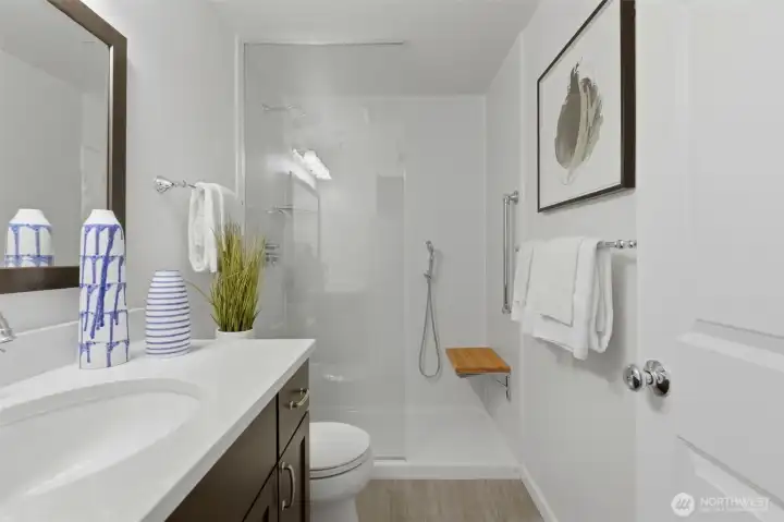 Renovated in 2024, the hallway bathroom is a gorgeous space with practical features and solid storage.