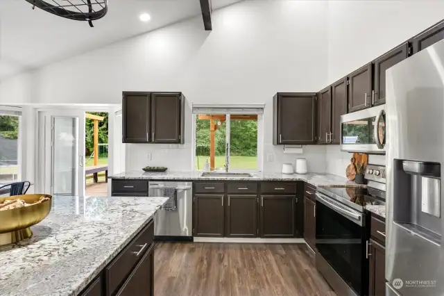 The kitchen features contemporary updates and opens into a spacious dining area.