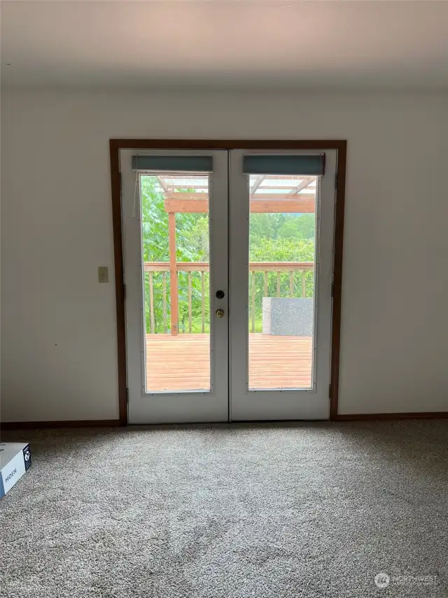 French doors in Master bedroom leading out to the deck
