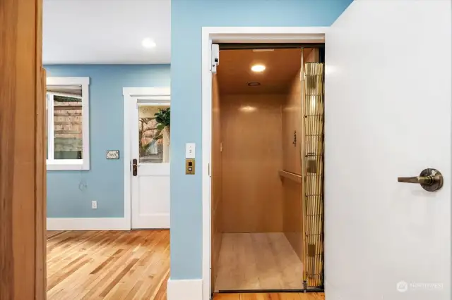 An elevator seamlessly connects all three levels, ensuring easy mobility throughout the home