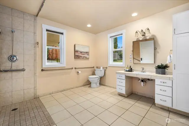 Thoughtfully designed with an accessible shower, sink, and cabinets to support ease and independence