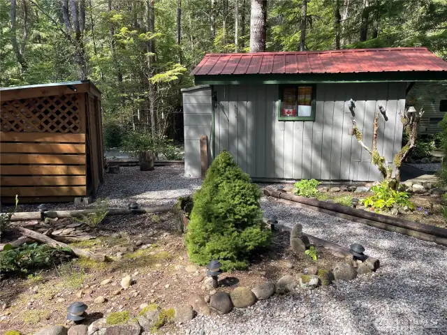 Shed & Woodshed positioned in front of property.