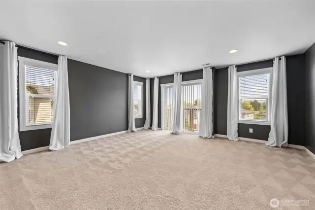 Primany Bedroom with lots of light and small balcony.