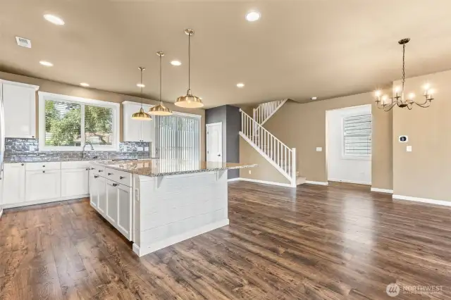 Heart of the home...DREAM custom kitchen with huge island and generous storage/counter space. Sit 6-8 bar stools.