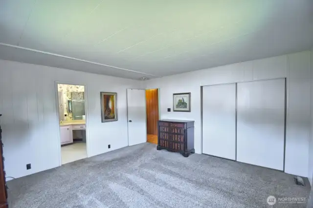 Primary closet runs full length of wall.