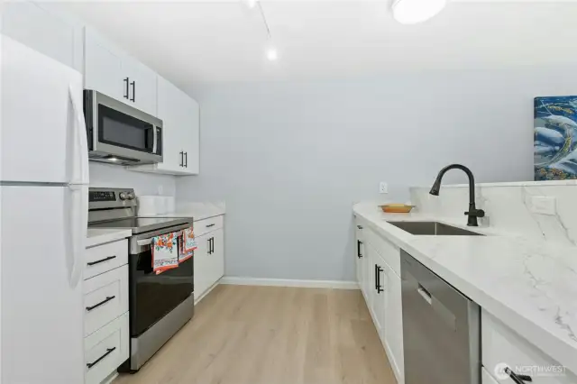 Beautiful kitchen with new cabinets, hardware, sink, faucet
