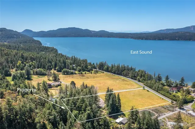 Nearly 4.5 acres of level land and no CC&Rs. Imagine the possibilities! Current home is already connected to Eastsound Water, private septic, and power.