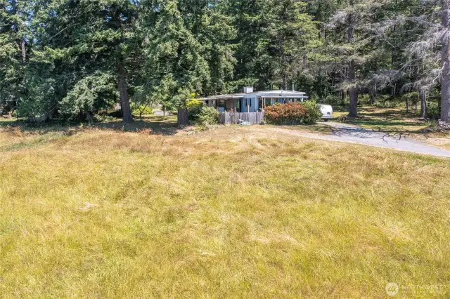 Manufactured home connected to power, water, and private septic.