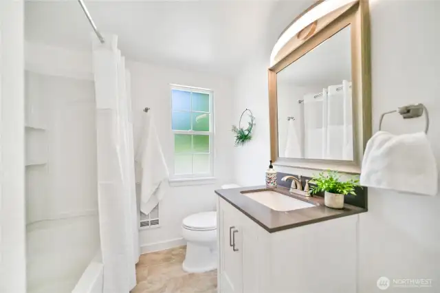 Full bath off hallway on main floor prerfectly appointed for bedroom 2  and guest use.