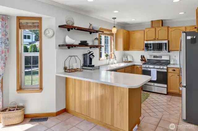Lots of storage in the kitchen with added space in the open shelving to display dishes and/or decor.