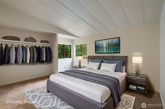 The huge primary bedroom is shown here with virtual staging.
