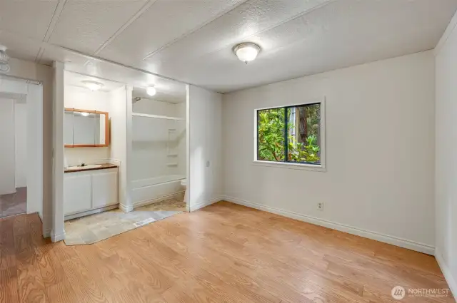 The extra finished room contains the second bathroom.