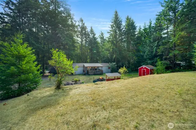 This view is from up upper cleared pasture area behind the home.