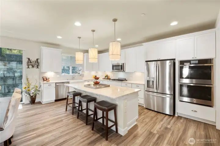 Gorgeous kitchen with SS appliances, gas stove, double ovens, microwave and walk-in-pantry.