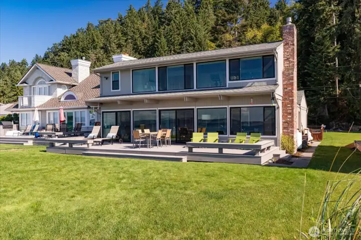 Single level waterfront home with second level Primary suite overlooking Puget Sound with sweeping views of the Olympic Mountains. New Trex deck, new windows and sliding doors. 8 year old roof, recently finished bulkhead, grass landscaping deck to beach.