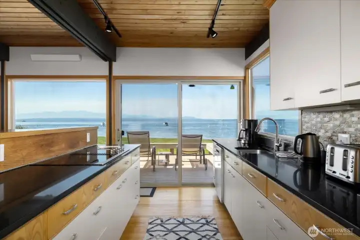 View from kitchen of sliders to waterfront deck.