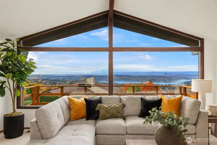 Framed by a dramatic window, the captivating views immediately draw you in.