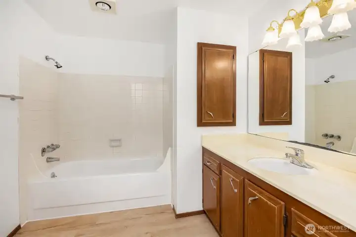 Full downstairs bath with oversized vanity.