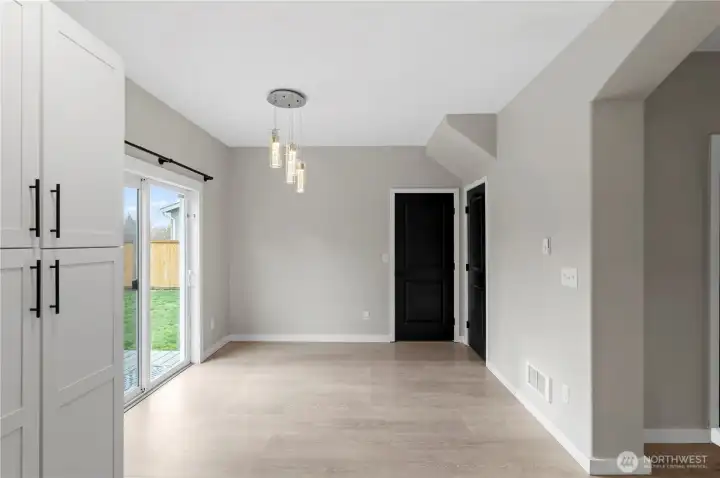 Light filled dining room overlooks the large backyard and access to the bonus room.