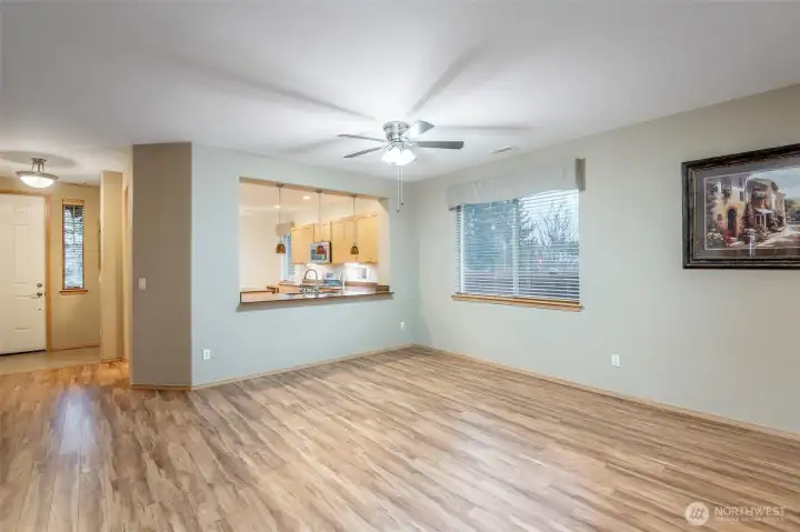 From the greatroom looking back to the dining room and open air breakfast bar. A perfect home for entertaining.