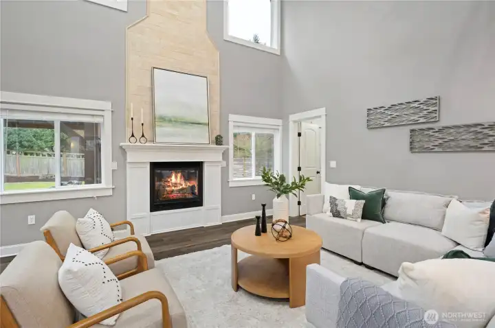 Cozy gas fireplace fills this room with warmth, light, and great views to the back yard.