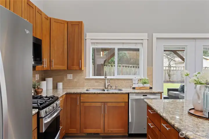 Looking out to the back yard that is fully fenced and south facing for maximum sunlight throughout the day.