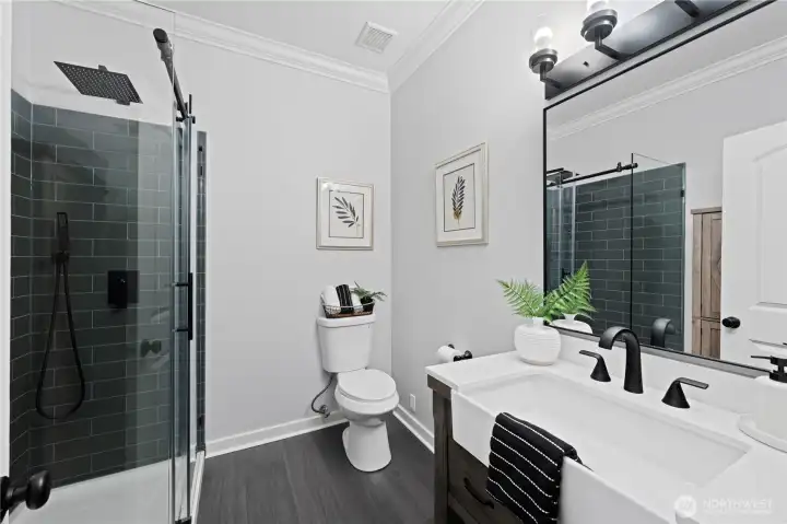 Fully remodeled 3/4 bath on the main floor with motion sensor light.