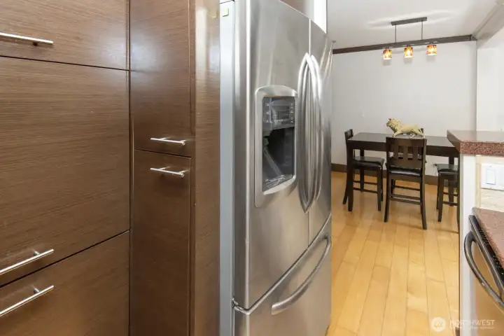 Such unique storage in the kitchen. Peaking into dining room area.