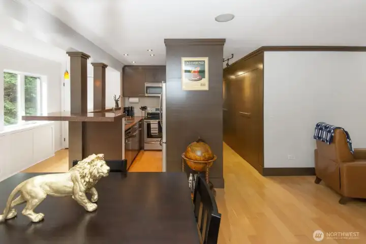 View of kitchen and hallway down to bedroom and bathroom.