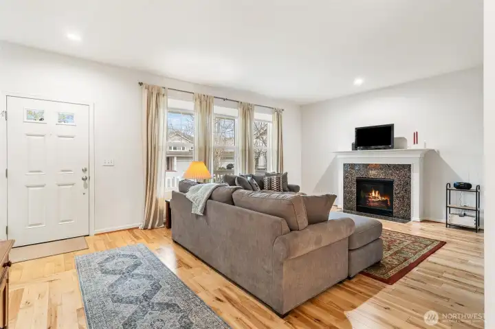 Natural light into the living room with gas fireplace