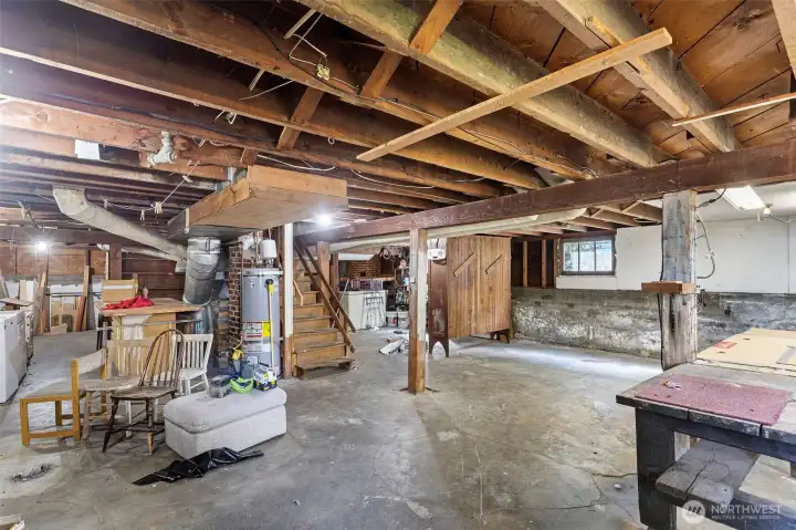Unfinished basement with good ceiling height.