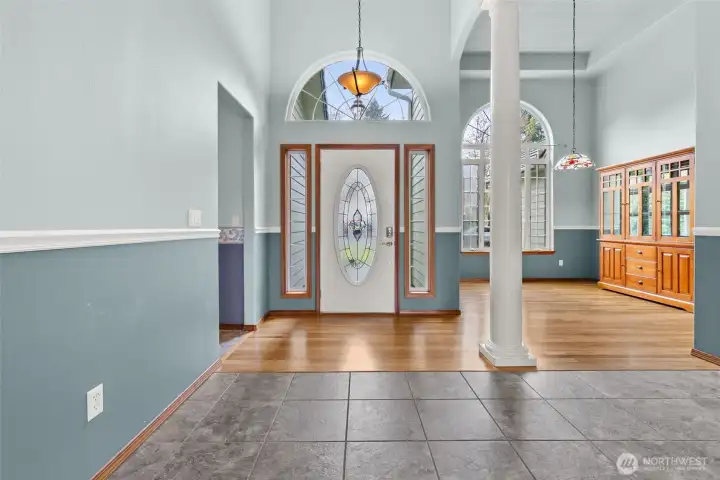 Soaring ceilings and high windows flood the area with natural light, even on the cloudiest of days!  Smart, easy care solid flooring covers entire home.  Tile, hardwood, LVP.