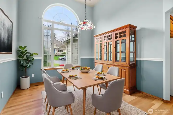 VIRTUALLY STAGED dining area.  Notice the tiffany style pendant lighting and decorator colors with chair rail finishes.