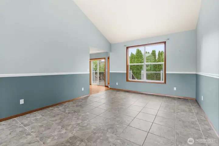 Another view of formal living room and kitchen/nook off to the left.