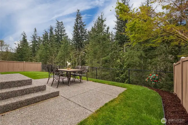 Fully fenced yard backs to a lush greenbelt for privacy and the entire yard is covered by an automated sprinkler system for easy maintenance