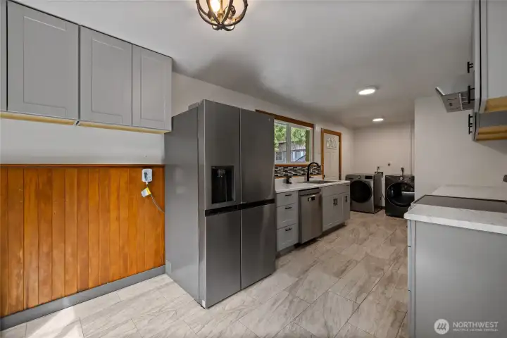 recently remodeled kitchen with cabinets, and countertops.