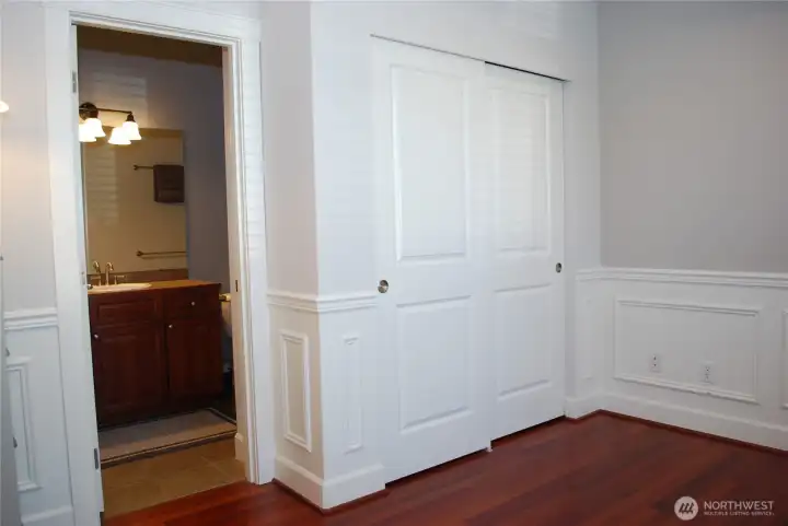 Private door joins the den to the main floor bathroom.  With an added closet in the den, it could act as a second primary suite if needed.