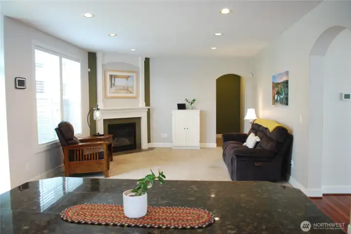 View from the kitchen across the island into the family room.