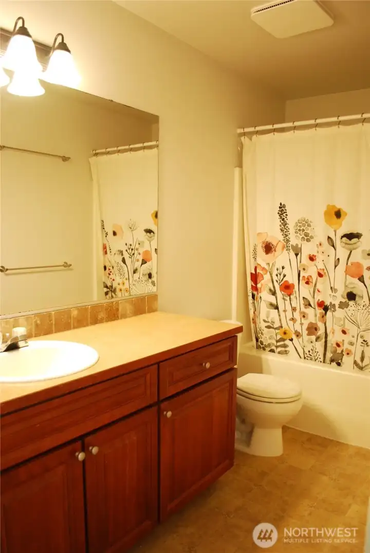 Kitty-corner to bedrooms 2 and 3 is the guest bathroom.
