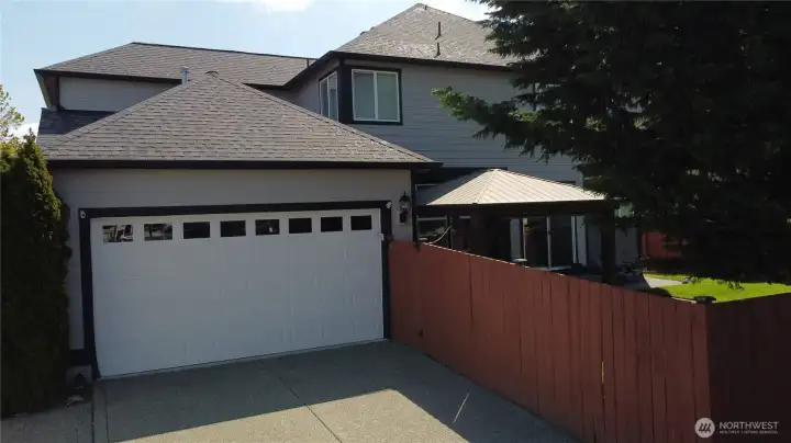 Alley access to 3 car tandem garage with 3 car width driveway and fully fence backyard.