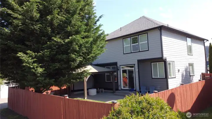 Impressive exterior with mature landscaping, washed aggregate walkways, designer paint, fully fence back yard, and rear patio with cover.