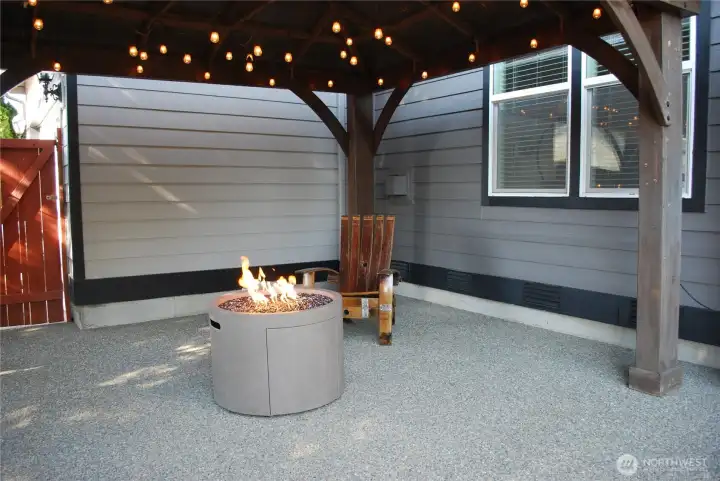 Exposed aggregate patio with cover.