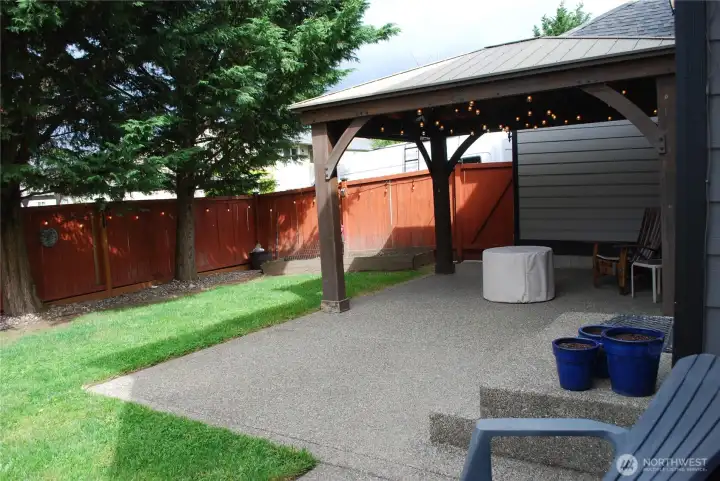 Impressive exterior with mature landscaping, washed aggregate walkways, designer paint, fully fence back yard, and rear patio with cover.