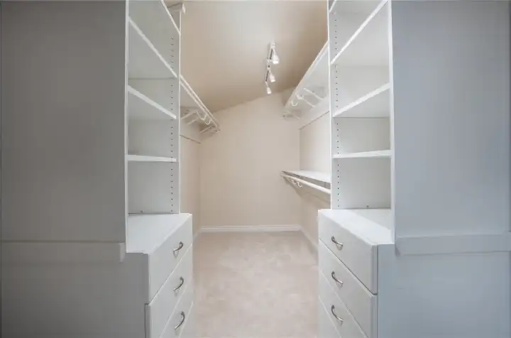 Upstairs primary walk in closet Upstairs primary walk in closet