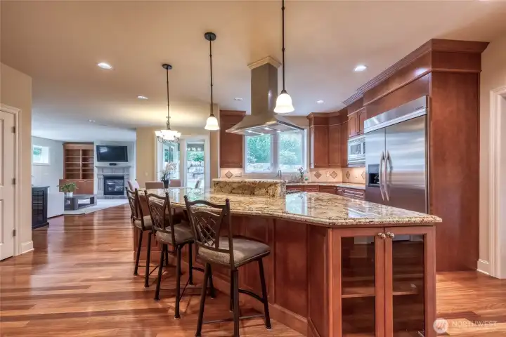 An impressive open-concept chef’s kitchen serves as the heart of the home. An impressive open-concept chef’s kitchen serves as the heart of the home.