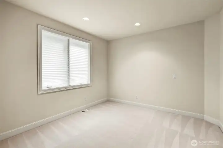 Spacious main floor bedroom. Spacious main floor bedroom.