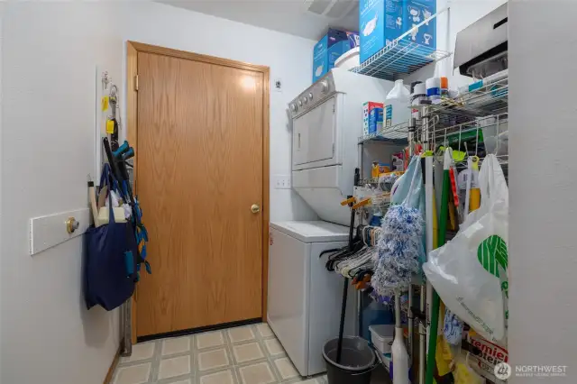 Large laundry room connected to garage.  Washer/dryer stay.