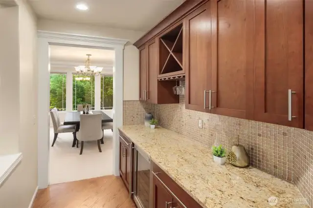 The stylish bar with built-in wine fridge is ideal for effortless entertaining.