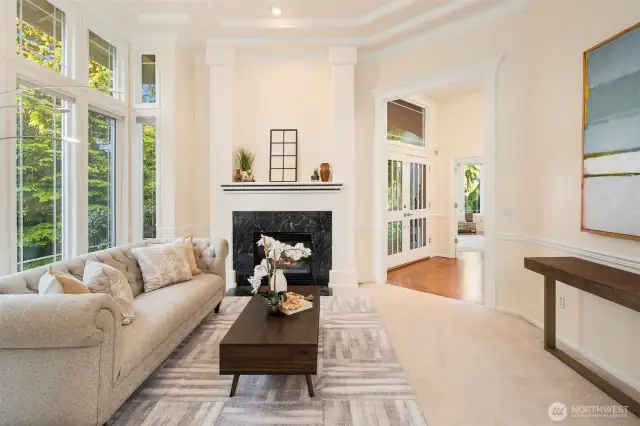 The formal living room features refined finishes and a serene, light-filled atmosphere.