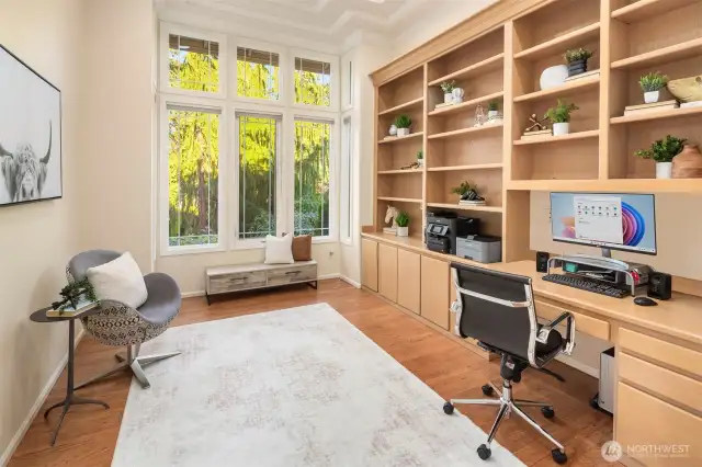 The private office features built-in shelves for organized and stylish storage.